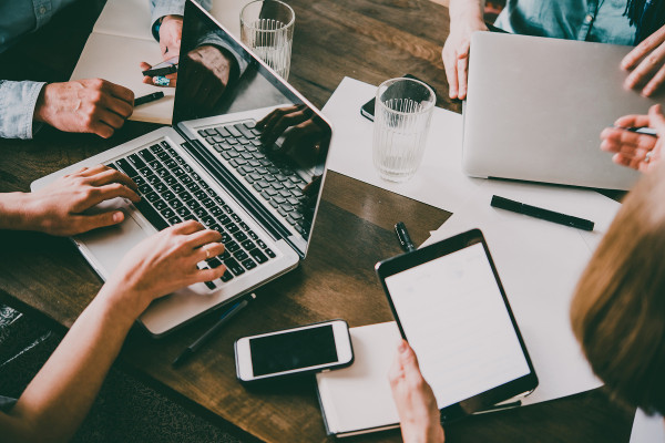 Busy Office Desks with Technology Devices