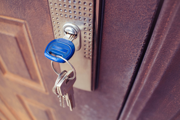A key in the lock of an iron door